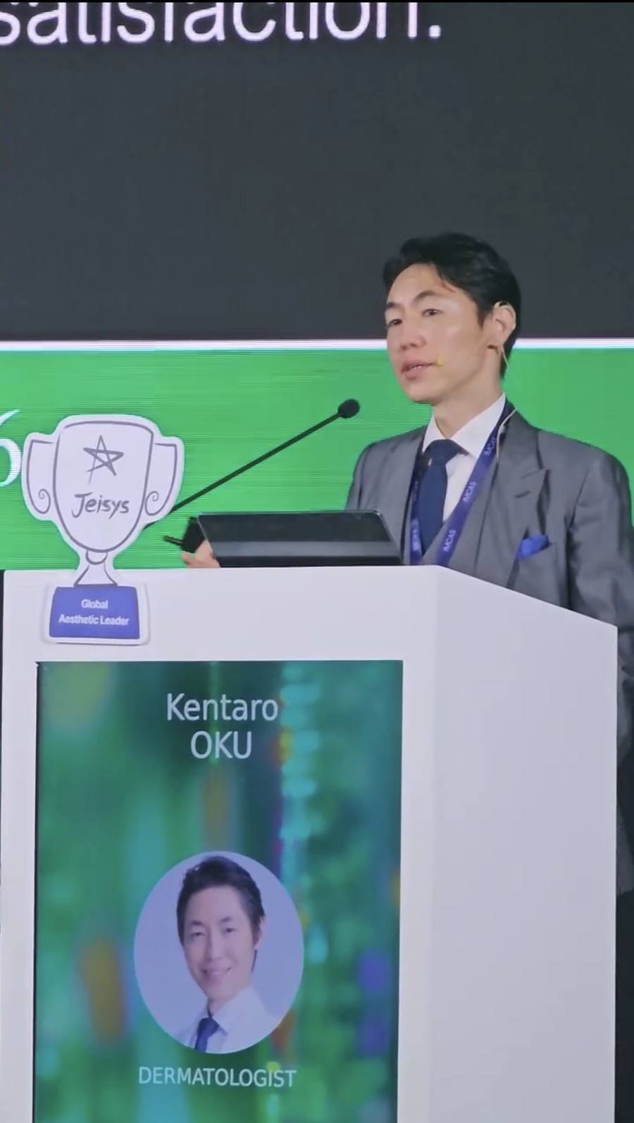 IMCAS ASIA 2026 Jeisysシンポジウムで講演するヒルズグレイスクリニック院長 奥謙太郎